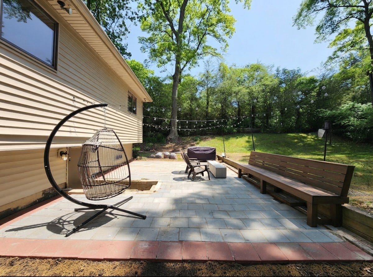 Custom bluestone paver patio with outdoor lounge seating, installed by Groundwork & Grain in NYC
